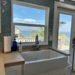 Large deep kitchen sink with our bay view - makes cleaning up quite a bit more pleasant!